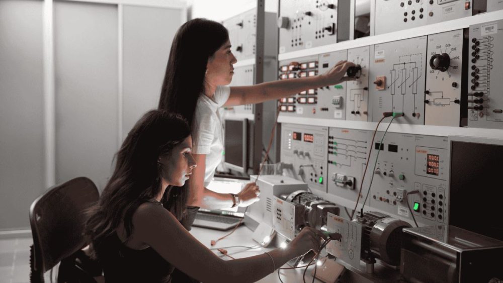 Two women students are working in a lab at the college